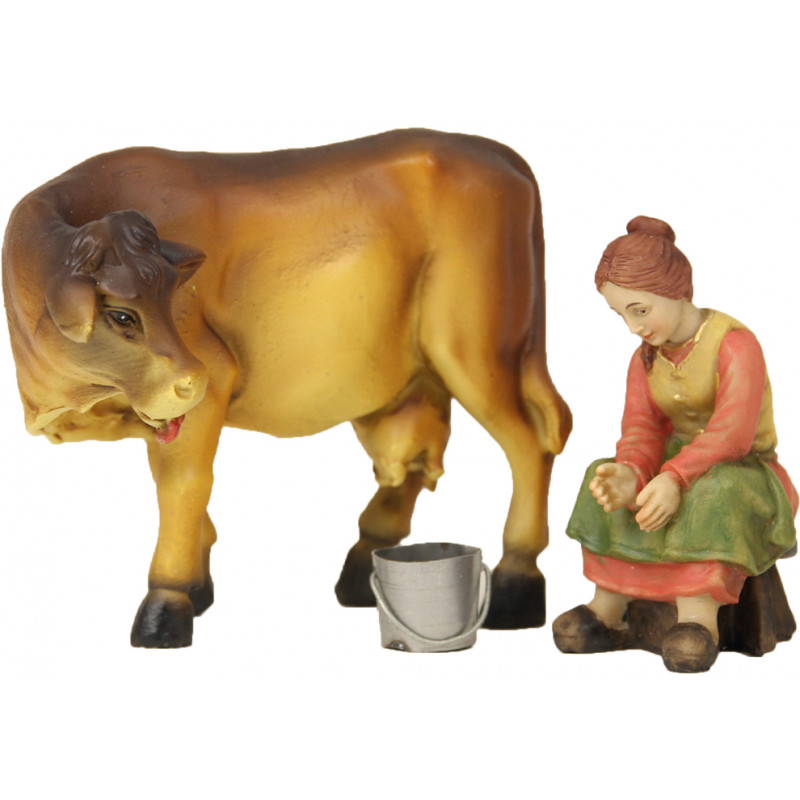 Mujer granjera con ordeño de vacas